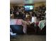 This living room features tile flooring and a large television for entertainment at 4727 Conrad St, Las Vegas, NV 89121