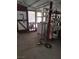 View of the covered patio with laundry machine, door access, and storage shelving at 4727 Conrad St, Las Vegas, NV 89121