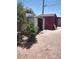 Exterior view of backyard storage shed with bushes and trees at 4727 Conrad St, Las Vegas, NV 89121