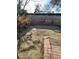 Landscaped backyard featuring a low block wall, brick accents and desert plants, perfect for outdoor enjoyment and privacy at 4795 Via San Andros, Las Vegas, NV 89103