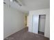 This bedroom has carpet flooring and a closet with sliding doors at 4795 Via San Andros, Las Vegas, NV 89103