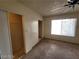 Cozy bedroom with a ceiling fan, carpet flooring, sliding closet door, and a bright window at 4795 Via San Andros, Las Vegas, NV 89103