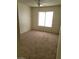 Neutral bedroom with carpeting and natural light from the window at 4795 Via San Andros, Las Vegas, NV 89103