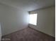 Cozy bedroom with carpeted flooring and a bright window at 4795 Via San Andros, Las Vegas, NV 89103