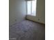 Simple bedroom featuring carpeted floors and a window at 4795 Via San Andros, Las Vegas, NV 89103