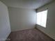 Cozy bedroom featuring carpet flooring, a bright window, and neutral paint at 4795 Via San Andros, Las Vegas, NV 89103