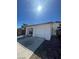 Charming single-story home featuring a two-car garage, complemented by well-maintained landscaping and desert foliage at 4795 Via San Andros, Las Vegas, NV 89103