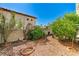 View of the backyard area with minimal landscaping and a block fence at 5016 Jacarilla Ln, North Las Vegas, NV 89031