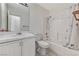 Bathroom featuring single sink vanity, toilet, and shower-tub combo at 5016 Jacarilla Ln, North Las Vegas, NV 89031