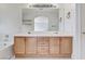 Bathroom features double vanity with tub and shower combo at 5016 Jacarilla Ln, North Las Vegas, NV 89031