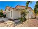 Charming single-story home features a Spanish tile roof and a two-car garage at 5016 Jacarilla Ln, North Las Vegas, NV 89031