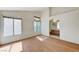 Spacious main bedroom with wood floors, an en-suite bathroom, and bright natural light at 5016 Jacarilla Ln, North Las Vegas, NV 89031