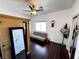 Bright bedroom with a futon sofa, wood floors, and walk-in closet at 5041 Portraits Pl, Las Vegas, NV 89149