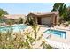 Community pool, spa, and sun deck area with lounge chairs and a covered patio, offering a relaxing outdoor experience at 5041 Portraits Pl, Las Vegas, NV 89149