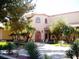 Elegant home exterior with a well-manicured lawn, mature trees, and inviting entrance at 5041 Portraits Pl, Las Vegas, NV 89149