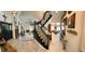 Grand foyer with marble floors, a staircase, and views into the living areas at 5041 Portraits Pl, Las Vegas, NV 89149