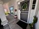 Front door, complete with screen door and decorative wreath, is charming and well-kept at 5041 Portraits Pl, Las Vegas, NV 89149