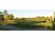 Beautiful and well-manicured golf course landscape with sand traps and rolling green hills at 5041 Portraits Pl, Las Vegas, NV 89149