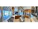Bright kitchen featuring stainless appliances, a pot rack, and a breakfast bar that overlooks an outdoor dining area at 5041 Portraits Pl, Las Vegas, NV 89149