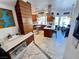 Open concept kitchen features stainless steel appliances, custom cabinets and eat in kitchen at 5041 Portraits Pl, Las Vegas, NV 89149