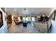 The open concept living area connects the kitchen, dining area and Gathering room, perfect for entertaining and everyday living at 5041 Portraits Pl, Las Vegas, NV 89149