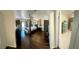 Spacious main bedroom features hardwood floors, four poster bed, and access to the outside patio at 5041 Portraits Pl, Las Vegas, NV 89149