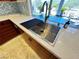 A modern kitchen sink with a view outside; note the white countertops and stainless faucet at 5041 Portraits Pl, Las Vegas, NV 89149