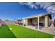 Lush backyard features artificial grass, a covered patio, and ample space for entertaining at 505 Sterling Falls Ave, Henderson, NV 89011
