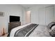 Comfortable bedroom showcases ample closet space, sleek TV, and neutral decor at 505 Sterling Falls Ave, Henderson, NV 89011