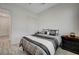 Cozy bedroom featuring neutral walls, wood-look floors, and comfortable-looking bed at 505 Sterling Falls Ave, Henderson, NV 89011