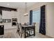 Dining area features stylish chairs, a dark wood table, and an elegant pendant light at 505 Sterling Falls Ave, Henderson, NV 89011