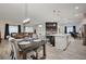 Open-concept dining area flows into a kitchen and living space, perfect for entertaining at 505 Sterling Falls Ave, Henderson, NV 89011