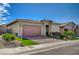 A cozy home with a two-car garage and a neatly landscaped front yard with green turf at 505 Sterling Falls Ave, Henderson, NV 89011