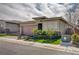Attractive residence with an attached garage, brick-paved driveway, and lush artificial turf at 505 Sterling Falls Ave, Henderson, NV 89011