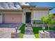 Charming single-story home with a well-manicured lawn and a welcoming brick walkway at 505 Sterling Falls Ave, Henderson, NV 89011