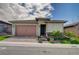 Inviting single-Gathering house featuring a two-car garage, manicured lawn, and a paved driveway at 505 Sterling Falls Ave, Henderson, NV 89011