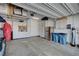 Spacious garage featuring built-in storage cabinets and a stainless-steel refrigerator, perfect for organization at 505 Sterling Falls Ave, Henderson, NV 89011