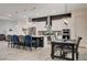 Contemporary kitchen featuring a large island, stainless appliances, and elegant barstool seating at 505 Sterling Falls Ave, Henderson, NV 89011