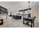 Spacious open-concept kitchen with a large island, sleek appliances, and an adjacent dining area at 505 Sterling Falls Ave, Henderson, NV 89011