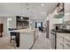 Open-concept kitchen with a large island, modern appliances, and a view of the living space at 505 Sterling Falls Ave, Henderson, NV 89011