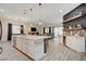 Expansive kitchen with a spacious island, stylish bar seating, and an open layout to the living room at 505 Sterling Falls Ave, Henderson, NV 89011