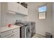 Functional laundry room with modern appliances, ample counter space, and natural light at 505 Sterling Falls Ave, Henderson, NV 89011