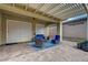 Elegant covered patio showcasing ample seating, a ceiling fan, and seamless indoor-outdoor living at 505 Sterling Falls Ave, Henderson, NV 89011