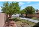 View of the backyard showing the white and gray shed and water feature at 5204 Padua Way, Las Vegas, NV 89107