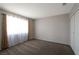 Bright bedroom offers plush carpeting and natural light from a large window at 5204 Padua Way, Las Vegas, NV 89107
