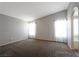 Large bedroom offers comfortable carpeting and natural light from windows at 5204 Padua Way, Las Vegas, NV 89107