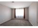 Neutral bedroom is carpeted, and has a window with curtains and a standard size closet at 5204 Padua Way, Las Vegas, NV 89107