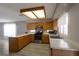 Well-lit kitchen features stainless steel appliances, wood cabinets, and sleek countertops at 5204 Padua Way, Las Vegas, NV 89107