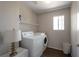 Functional laundry room equipped with modern washer and dryer, plus storage at 5204 Padua Way, Las Vegas, NV 89107