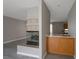 Living room featuring a fireplace and a wet bar at 5204 Padua Way, Las Vegas, NV 89107